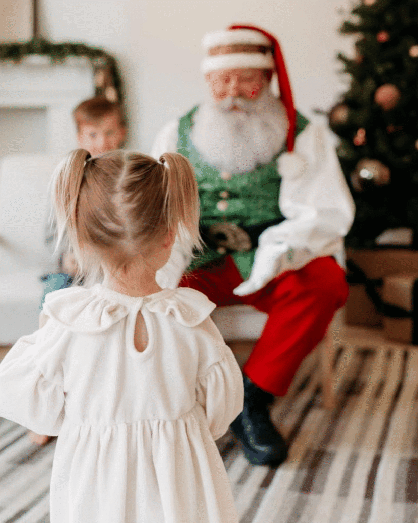 Small child walks to Santa